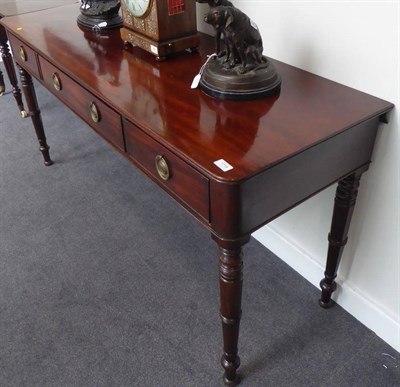 Lot 1719 - A Late George III Mahogany Side Table, early 19th century, with reeded edge above one large and two
