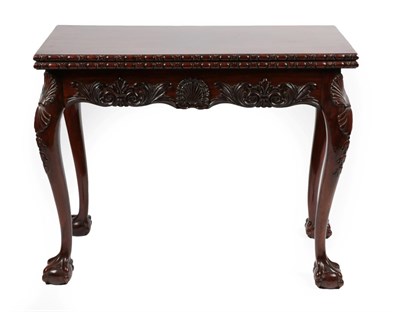 Lot 1724 - A Carved Mahogany Foldover Card Table, in George II Irish Style, late 19th century, the...