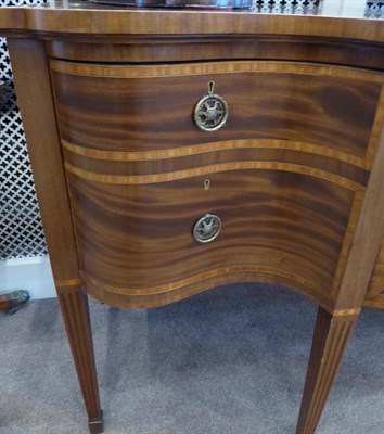 Lot 1727 - A Late George III Mahogany, Satinwood Banded and Ebony Strung Serpentine Shape Sideboard, early...
