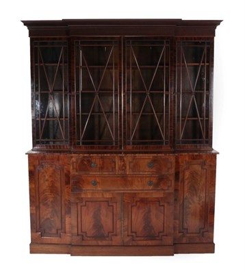 Lot 1729 - A George III Style Mahogany Breakfront Library Bookcase, 19th century and later, the dentil cornice