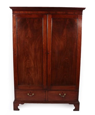 Lot 1751 - A George III Mahogany Double Door Wardrobe, circa 1800, the dentil cornice above moulded...