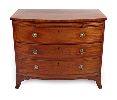 Lot 1752 - A George III Mahogany Bowfront Bachelor's Chest, late 18th century, the pull-out brushing...