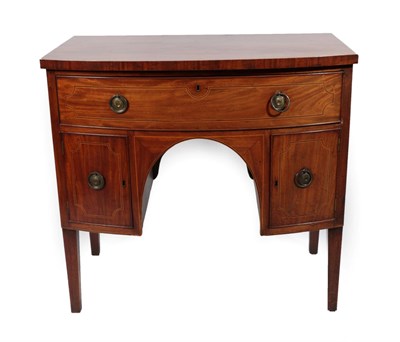 Lot 1753 - A George III Mahogany, Boxwood and Ebony Strung Bowfront Sideboard, early 19th century, with a long