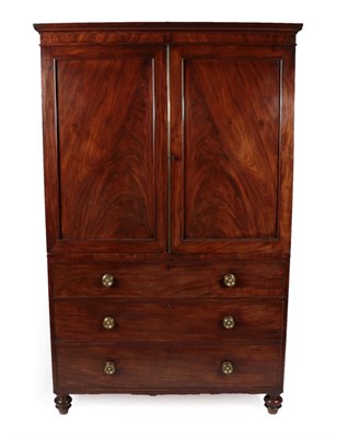 Lot 1755 - A Mahogany Linen Press, circa 1830/40, the moulded cornice above two panelled cupboard doors...