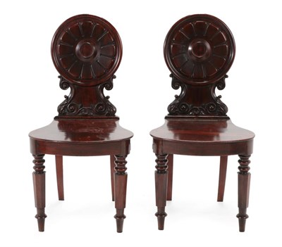 Lot 1758 - A Pair of Victorian Carved Mahogany Hall Chairs, circa 1860, with moulded and carved circular...