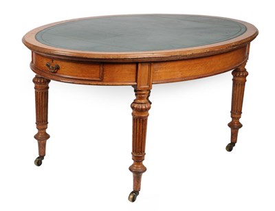 Lot 1762 - A Victorian Oak Library Table, 3rd quarter 19th century, of oval form with green leather...