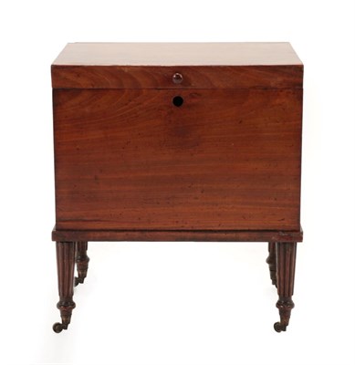 Lot 1771 - ~ A Mahogany Cellaret, of square form with hinged lid, on reeded tapering legs with brass...