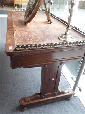 Lot 1773 - ~ An Early Victorian Mahogany Writing Table, mid 19th century, the pierced brass three-quarter...