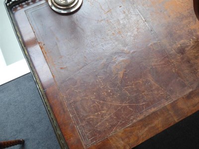 Lot 1773 - ~ An Early Victorian Mahogany Writing Table, mid 19th century, the pierced brass three-quarter...