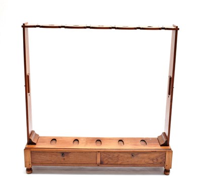 Lot 1793 - A 20th Century Beech Campaign Rifle Stand, the C scroll top support with five pierced apertures...