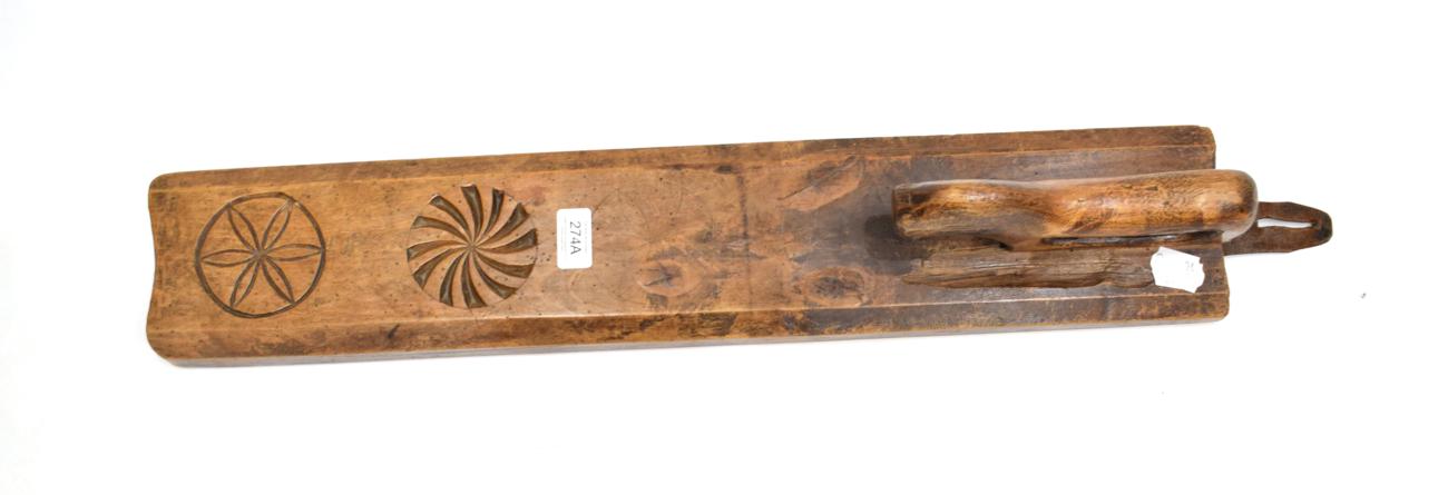 Lot 274 - A Scandinavian Treen Mangle Board, 18th century, of rectangular form with animal form handle...