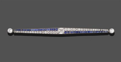 Lot 358 - An Art Deco Sapphire and Diamond Bar Brooch, an old cut diamond centrally, within tapered bars...