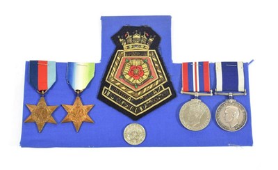 Lot 48 - A Second World War Naval Group of Four Medals, awarded to M.38967 T.G.WILCOX. SY.P.O....