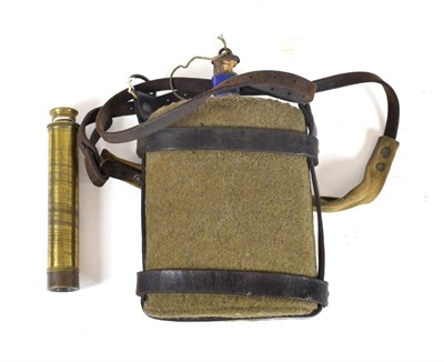 Lot 88 - A First World War Water Canteen, the blue enamelled tin body covered in khaki wool, with...