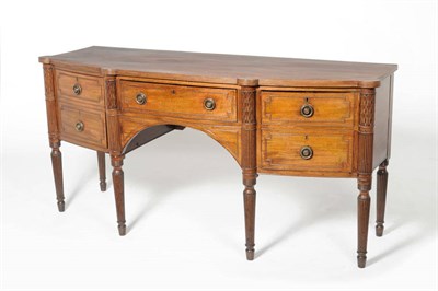 Lot 1605A - A George IV Mahogany Bowfront Sideboard, 2nd quarter 19th century, the reeded edge above a...