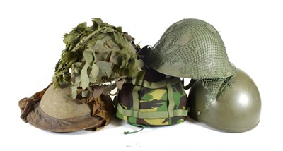 Lot 129 - Five British Army Helmets, including a Second World War Brodie helmet by J.C.S.& W.Ltd, dated 1939