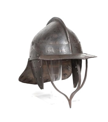 Lot 139 - A 17th Century Civil War Harquebusier's Lobster Tail Helmet, the skull made from two pieces...