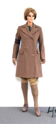 Lot 143 - A Second World War Women's Land Army Composite Uniform, comprising a greatcoat, size 14, with label