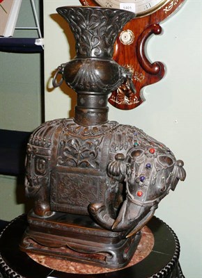 Lot 348A - A Chinese Bronze and Gem Set Altar Figure as an Elephant, Qing Dynasty, surmounted by a yenyen vase