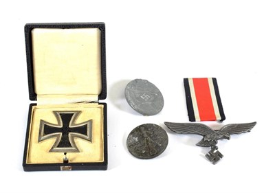 Lot 165 - A German Third Reich Iron Cross, First Class, with sword shape pin, in case of issue; three...