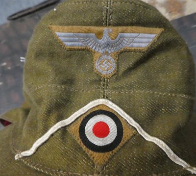 Lot 167 - A German Third Reich EM's M41 Tropical Field Cap, in olive/khaki cotton, the front of the cap...