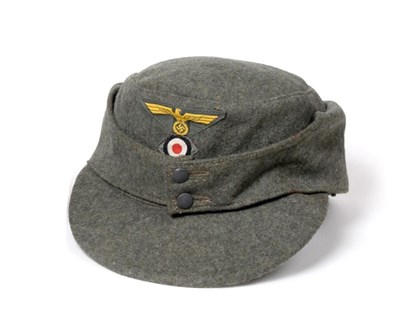 Lot 171 - A German Third Reich M43 Army EM's/NCO's Field Cap, in field grey wool, with machine...