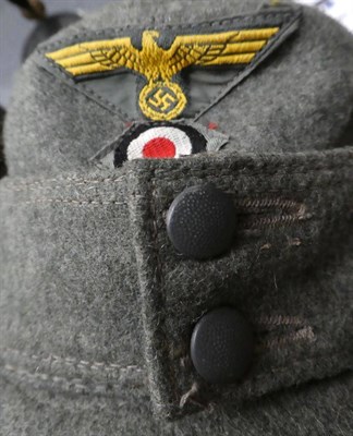 Lot 171 - A German Third Reich M43 Army EM's/NCO's Field Cap, in field grey wool, with machine...