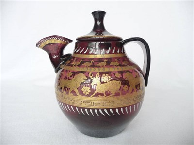 Lot 1 - A Continental Amethyst Glass Jug and Cover in Archaic Persian Style, 19th century, of...