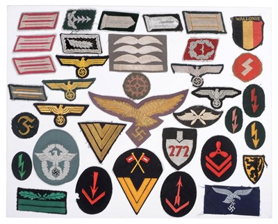 Lot 191 - A Collection of Forty One German Third Reich Cloth Insignia, including a Luftwaffe cape eagle...