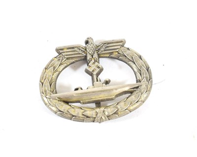 Lot 197 - A German Third Reich U-Boat War Badge, in gilt washed white metal, the reverse with vertical...