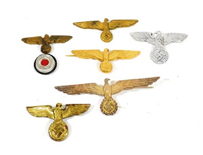 Lot 207 - Six German Third Reich Metal Visor Cap and Breast Eagles, including a Kriegsmarine 'Donald...