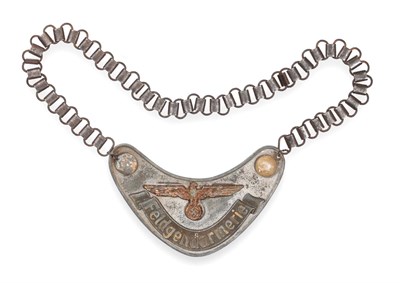 Lot 214 - A German Third Reich Feldgendarmerie (Field Police) Gorget, of aluminium with applied eagle and...