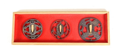 Lot 251 - Three Japanese Iron Sukashi Tsuba, one of kaku gata form, chased with prunus blossom, 7.5cm, two of