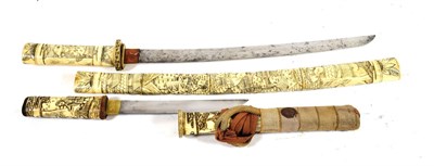 Lot 256 - A 19th Century Japanese Bone Tanto, with 18cm steel blade, one piece brass habaki, the hilt and...