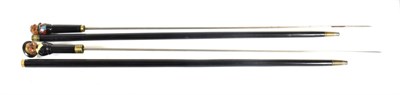 Lot 262 - Two Ebonised Swordsticks, each with 70.5cm square stiletto type blade, gilt metal collar, the...