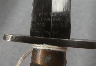 Lot 312 - A US Third Pattern Commando Knife by Winchester, the 17.5cm double edge blackened steel blade...