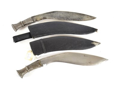 Lot 321 - An Early 20th Century Nepalese Kukri, the 31cm broad curved steel blade with double fuller to...