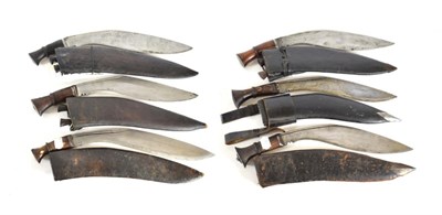 Lot 322 - A Second World War Nepalese 'Budhume' Kukri, the 37cm broad curved steel blade with two narrow...