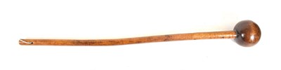 Lot 329 - A Zulu Knobkerrie, of dense honey coloured wood, with globular head and tapering haft, 67cm