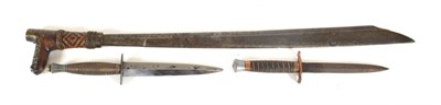 Lot 330 - A 19th Century Borneo Mandau, the 53cm single edge steel blade inlaid at the ricasso with mata...