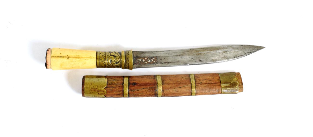 Lot 331 - A Burmese Dha Knife, the 14cm single edge slightly curved steel blade inlaid at the ricasso...