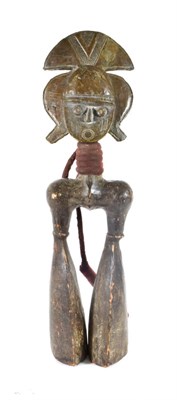 Lot 343 - A Kota Figural Wood Hand Drum, the head covered in sheet brass, the dished oval face with...