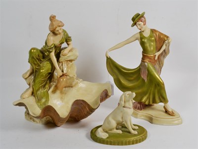 Lot 19 - A Royal Dux model of a flamenco dancer; another model of a girl at a well, with shell form...