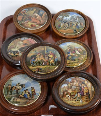 Lot 23 - A 19th century Pratt ware pot lid, depicting a dentistry scene together with six other 19th century