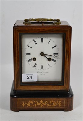 Lot 24 - A French inlaid striking mantel clock, retailed by Sewell & Son, A Paris, movement back plate...