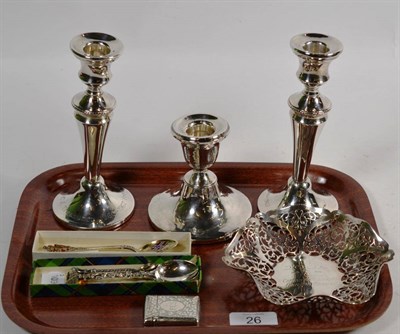 Lot 26 - An Elizabeth II silver dish, a Victorian vesta case, a pair of candlesticks, filled, a single...