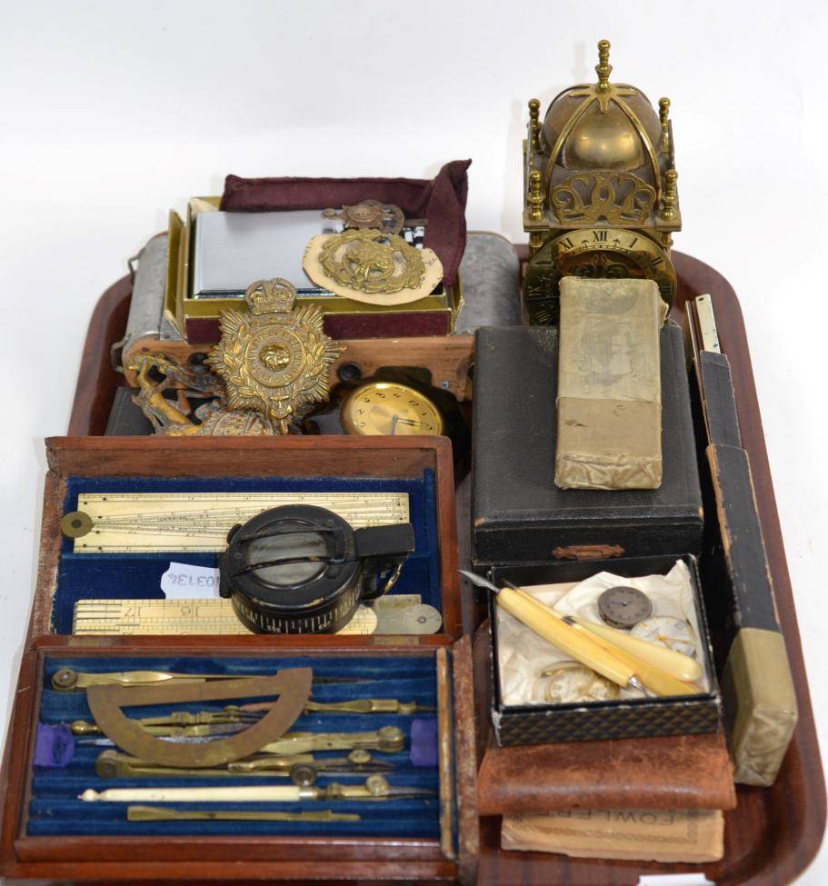 Lot 27 - A WWII prismatic marching compass, an Edwardian cased draughtsman set including ivory rule by A...