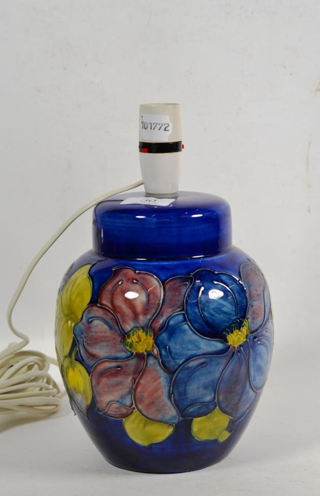Lot 30 - A Moorcroft table lamp, clematis pattern, blue ground, 21cm high