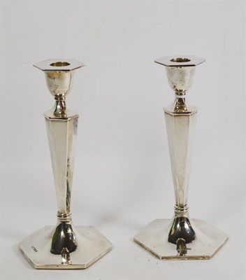 Lot 44 - A pair of George V silver candlesticks, by Walker and Hall, Sheffield, 1919, each on six sided base