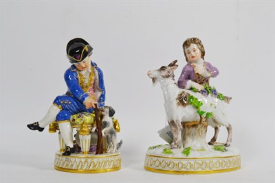 Lot 47 - A Meissen porcelain figure of a huntsman, late 19th century, sitting on a stool holding a...